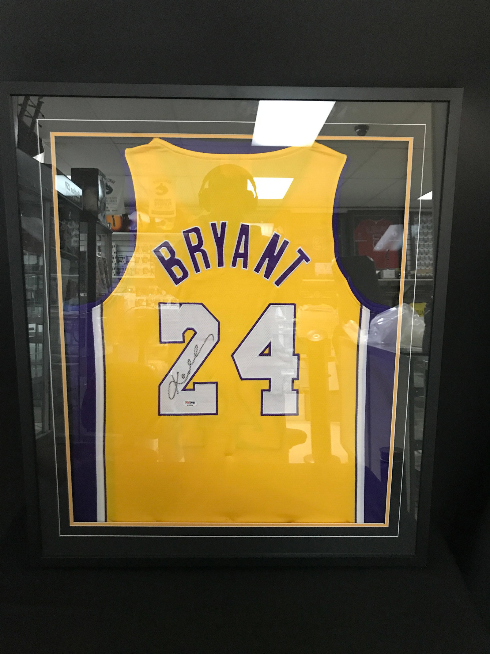 KOBE BRYANT SIGNED AND FRAMED LOS ANGELES LAKERS BASKETBALL JERSEY - PSA COA (1 of 2)
