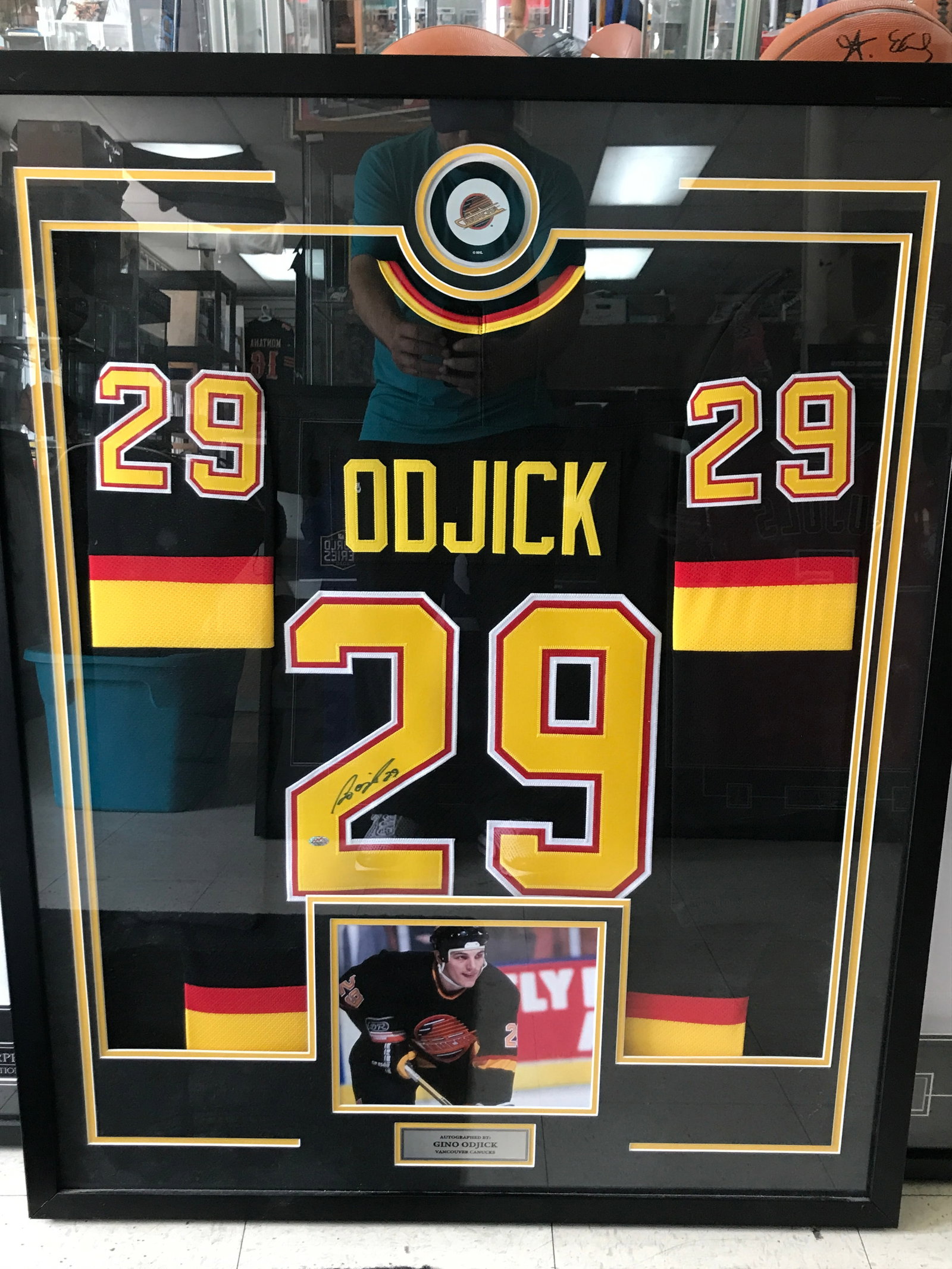GINO ODJICK SIGNED AND FRAMED VANCOUVER CANUCKS HOCKEY JERSEY (MOUNTED MEMORIES COA): Prices are in Canadian dollars