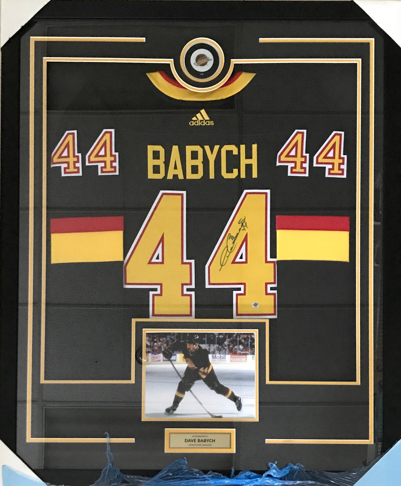 DAVE BABYCH SIGNED AND FRAMED VANCOUVER CANUCKS HOCKEY JERSEY EAST COAST COA: Prices are in Canadian dollars