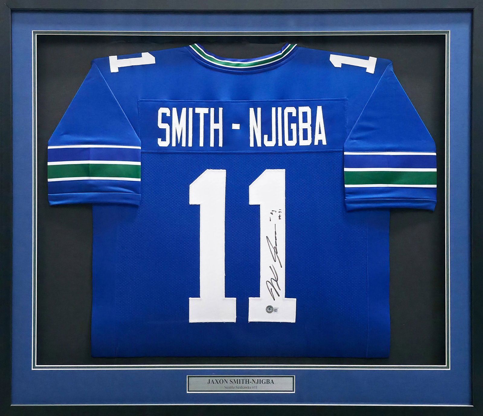 JAXON SMITH-NJIBA SIGNED AND FRAMED SEATTLE SEAHAWKS JERSEY - BECKETT COA: Prices are in Canadian dollars