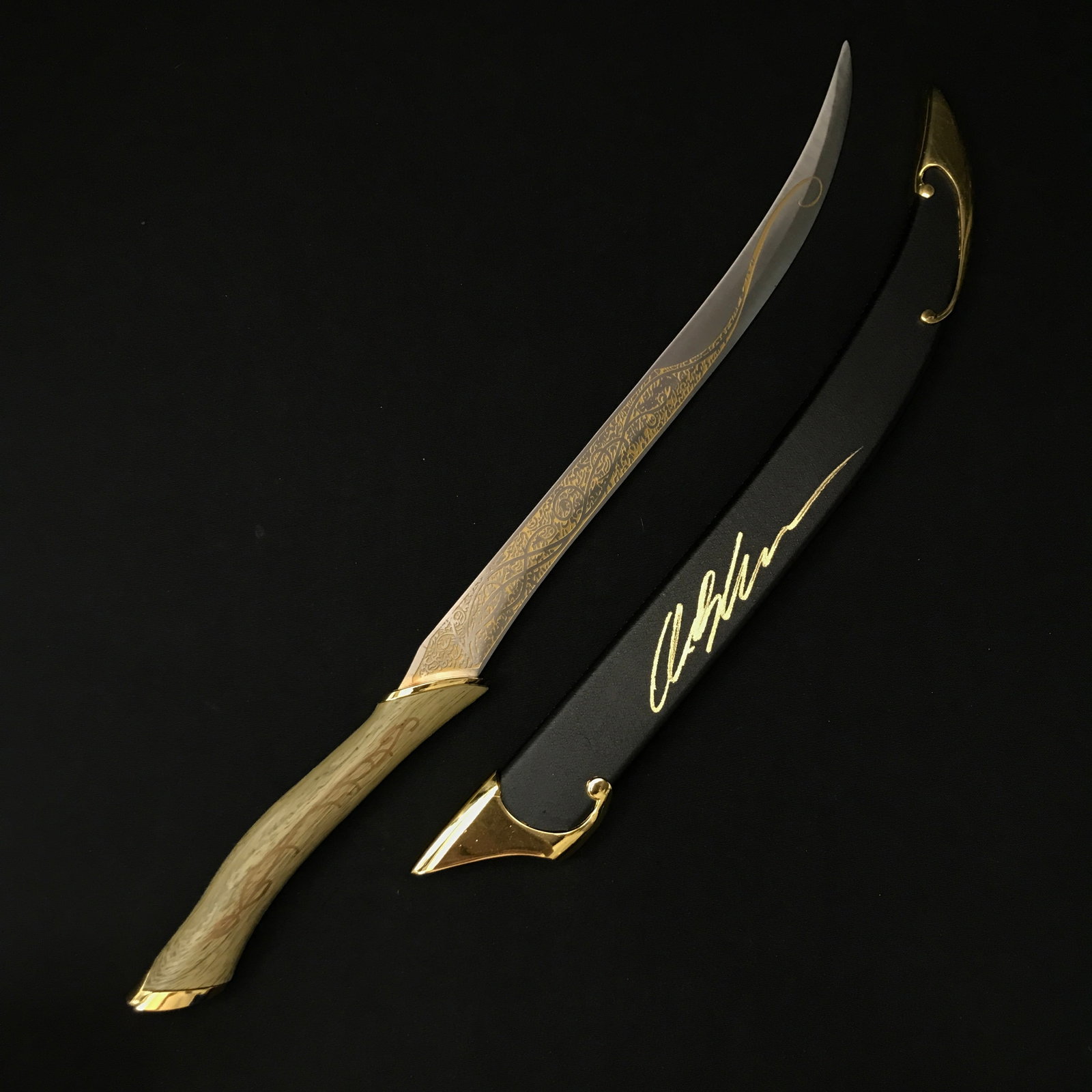 ORLANDO BLOOM SIGNED LEGOLAS LOTR SWORD SHEATH - WWOC COA: Prices are in Canadian dollars