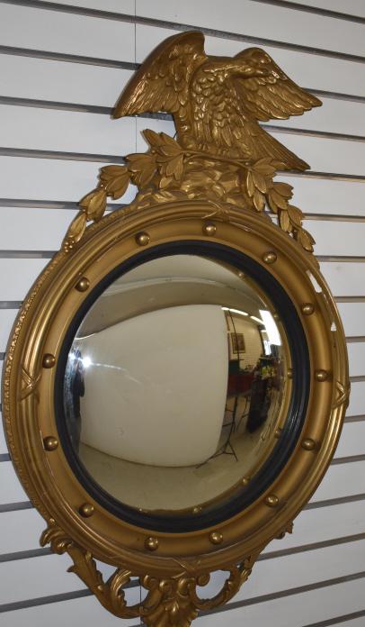 Federal style gilt framed convex mirror: 38n1/2"w x 24"w Condition, some loss of gilt, cracked gilt, and gilt flaking