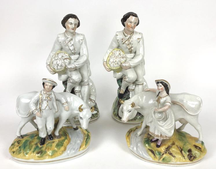 Pair of Staffordshire figures of gentlemen: Together with pair of Staffordshire style figures with cows Tallest 13"h Condition, old repair to woman's arm, missing thumb, some firing cracks