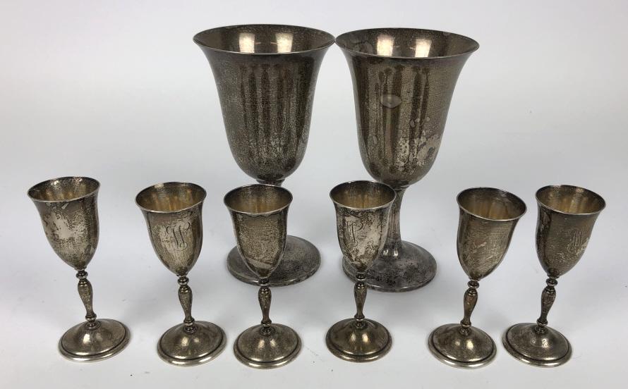 Pair of sterling silver wine goblets: Together with 6 sterling silver cordial glasses Wine goblets 6 3/4"h Total approximately 16 ounces Condition, monogrammed, needs cleaning