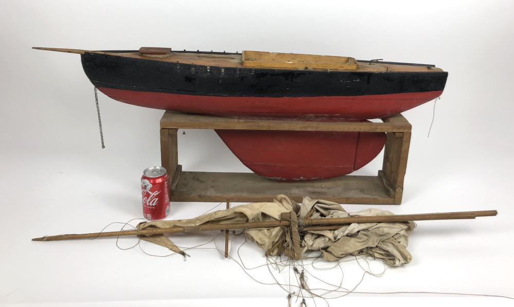 Wooden boat model on stand: With rigging Boat 15"h x 41"w with out rigging Condition, rigging need to be re assembled, tears to sails, overall wear