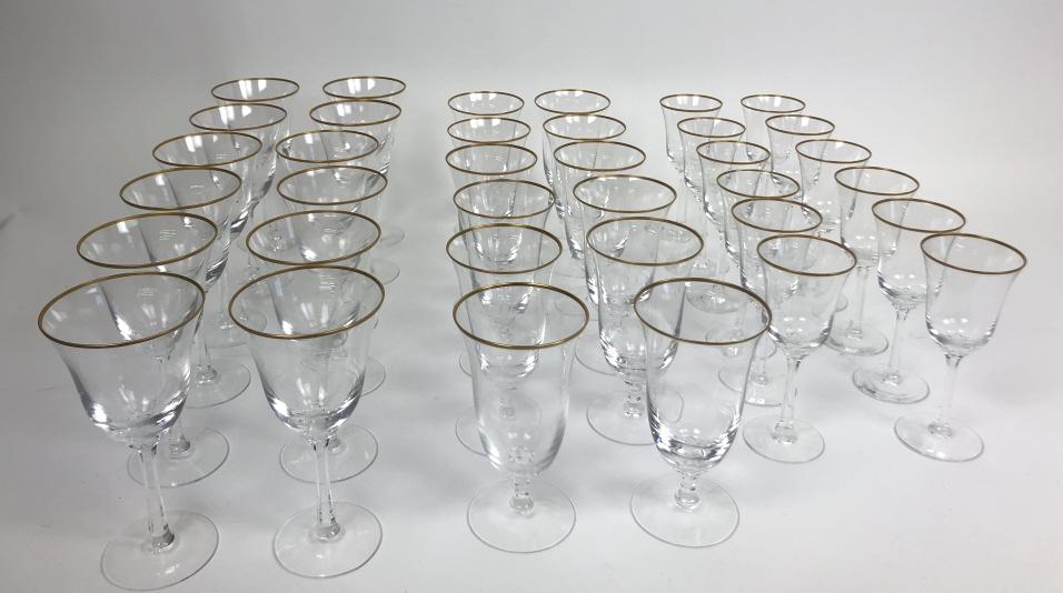 Set of Lenox crystal and gilt rimmed glasses: Approximately 36, (12 large, 12 medium, 12 small) Condition, one minor chip to smallest size glasses
