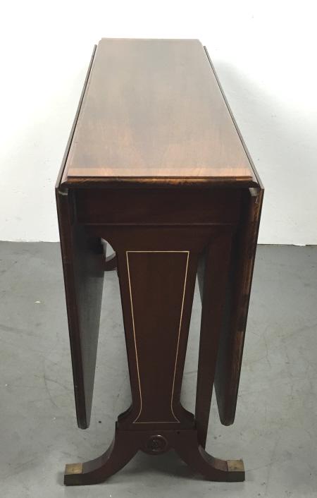 Mahogany Sutherland table: With inlay and cross banding 29 1/4"h x 13"w fully extended 54"w x 40"d Condition, some scratches
