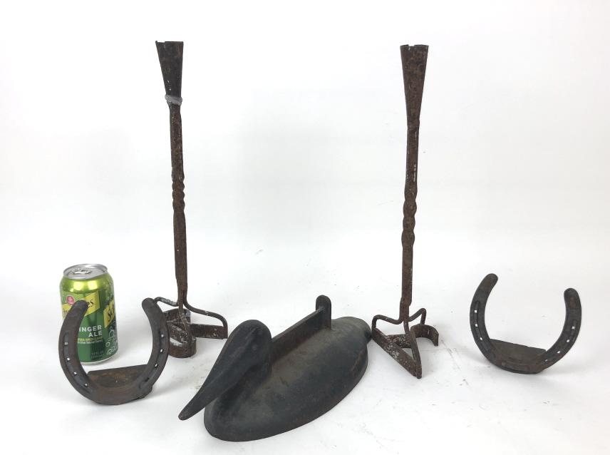 Miscellanous group of metal articles: Including two branding iron candlesticks, pair of horseshoe bookends and duck-form boot scraper. Tallest 16"h Condition, some rust