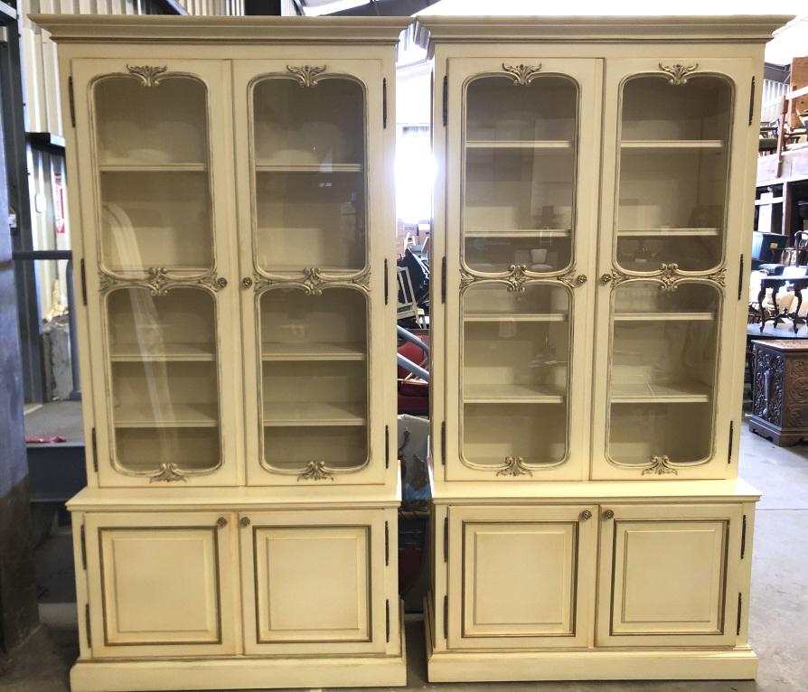 Pair of Louis XVI style cream painted bookcases: 94 1/2"h x 48"w x 19 1/4"d Bookcases are in one piece, with led lighting strips Condition, good, missing transformers for LED lights, untested