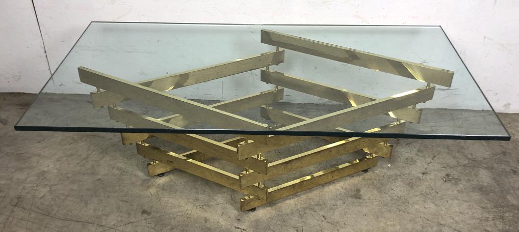 Mid Century Modern style brass and glass low table: 17'h x 48"w x 24"d Condition, needs polishing, some scratches on glass, wear to plate