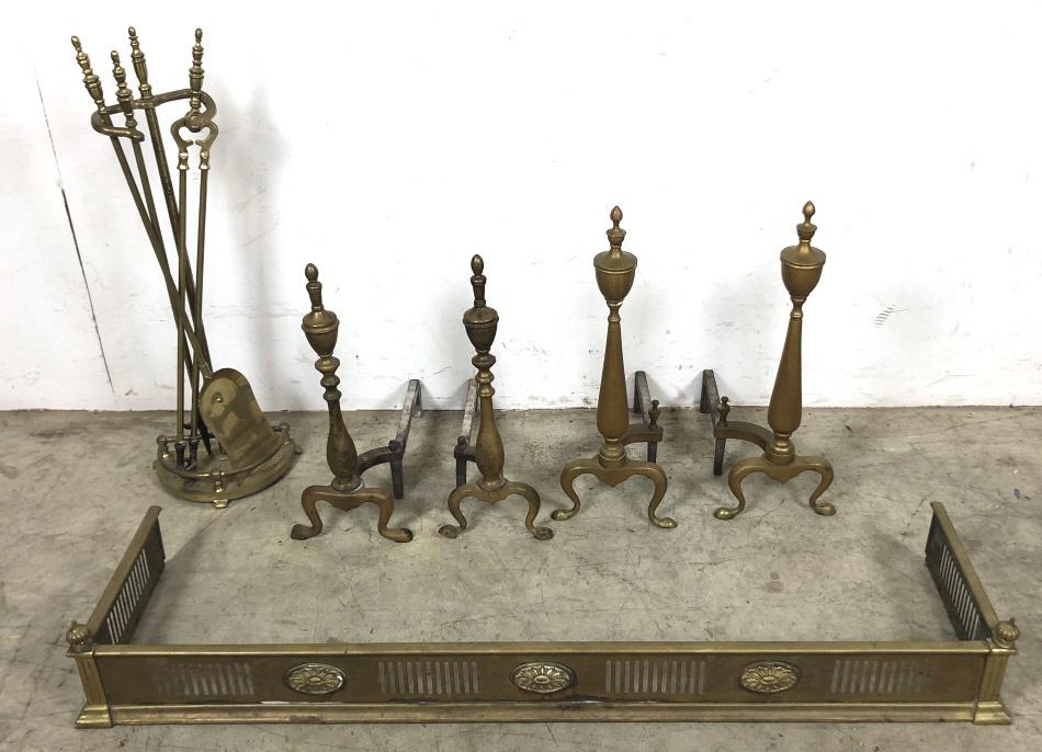 Brass fire fender, andirons and fire tools: Comprising, fender, two pairs of andirons, and fire tools Fender 7"h x 50 1/2"w x 13"d Condition, needs polishing