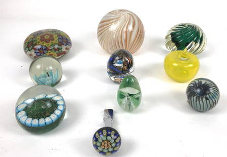 Group of glass paperweights: Together with bottle opener Approximately 10 pieces Largest 4"h x 4 3/4" dia Condition, some scratches