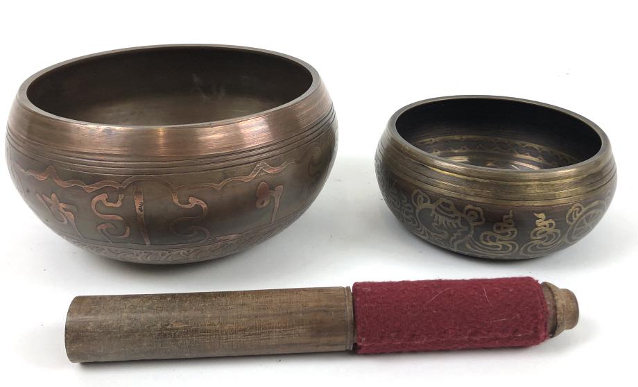 Two Tibetan singing bowls: Larger 3 1/2"h x 6 3/4'dia Condition, light wear