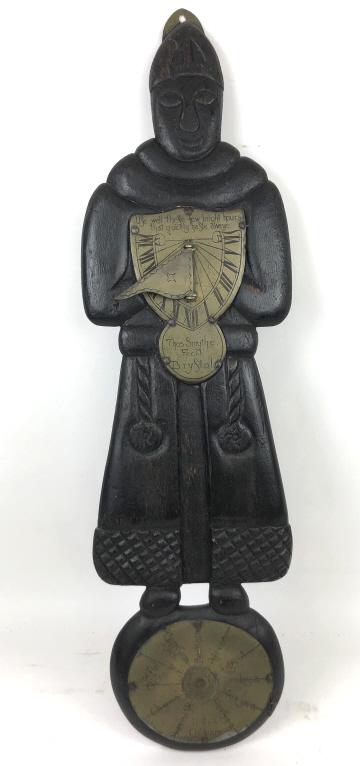 English carved figural wall sundial: 35"H 10"W Condition, overall wear to finish, cracked wood