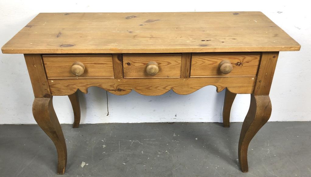 Pine three drawer side table: 30 3/4"h x 48"w x 19 3/4"d Condition, scratches, scuffs, dings, chipped wood to one leg