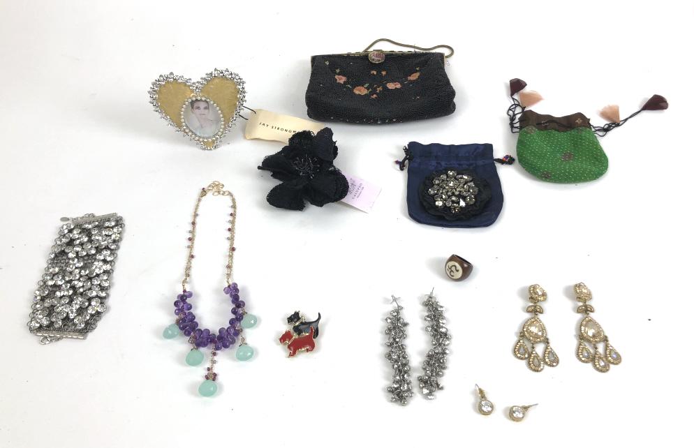 Group of costume jewelry: Including Fargamo bracelet, Prada broach etc Approximately 12 pieces Condition, one dog pin missing pin