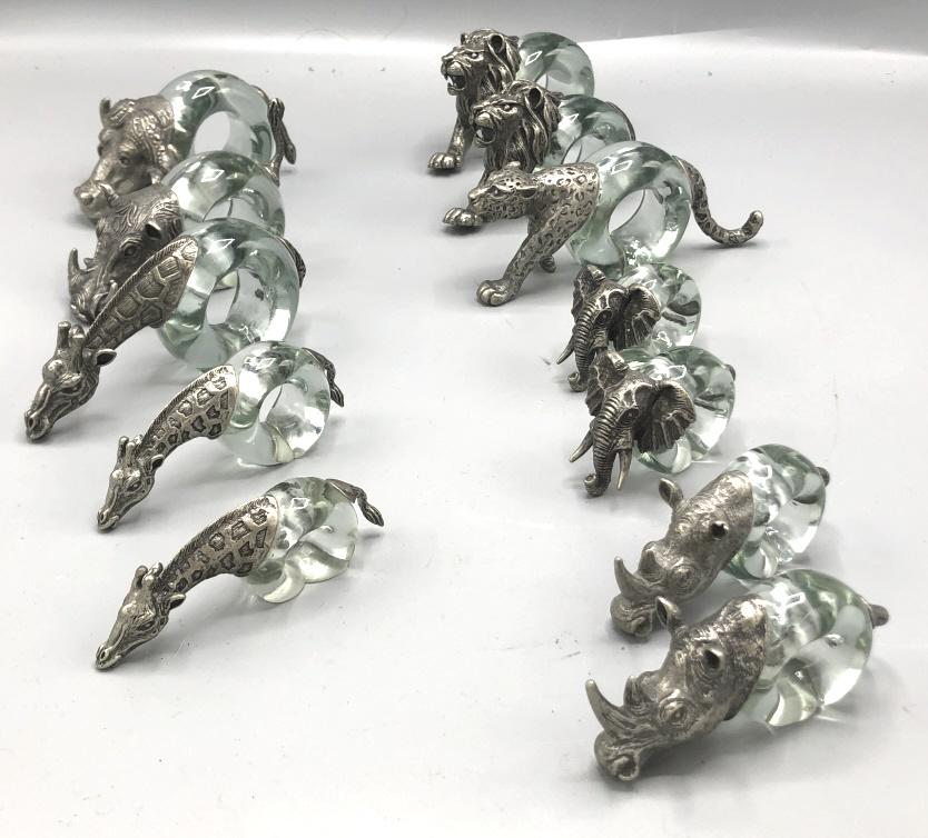 Group of 12 glass and metal napkin rings: In animal form Tallest 3" Condition, good