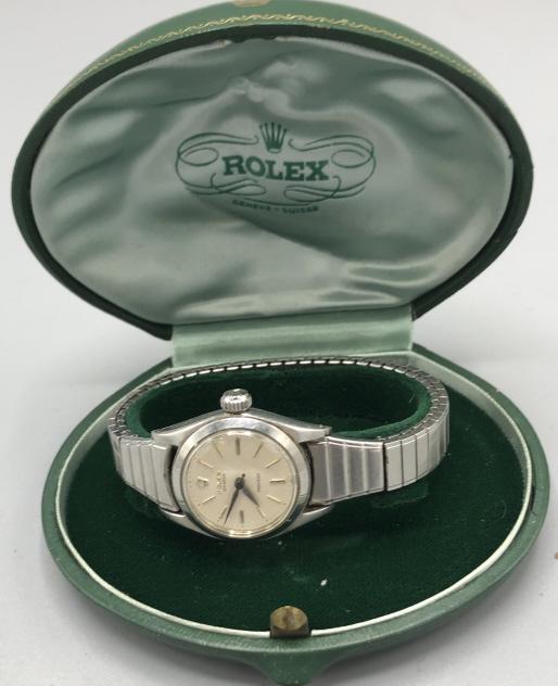 Ladies Rolex stainless steel wrist watch: With replaced wrist strap. Condition, needs cleaning, untested