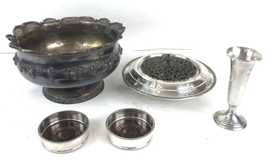 Gorham sterling silver weighted vase: Together with a silver plated punch bowl, Reed and Barton flower bowl and a pair of wine coasters. The vase is 8 3/4" high, Condition, overall wear and worn plant , some cracks and dents