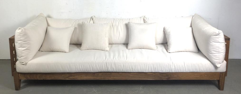Teak Upholstered Sofa: With leather netting inside the panels Retailed by Bergdorf Goodman 34" h x 109 3/4" l x 36 1/2" d Condition, Some cracked wood, scratches and scuffs, needs cleaning, some minor stains to fabric, some