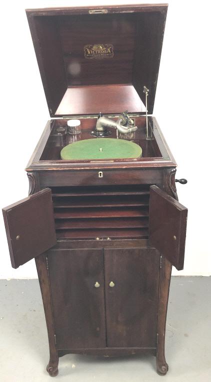 Mahogany Victrola: 43 1/2" h x 20" w x 23" d. Condition, worn finish, chips and scuffs.