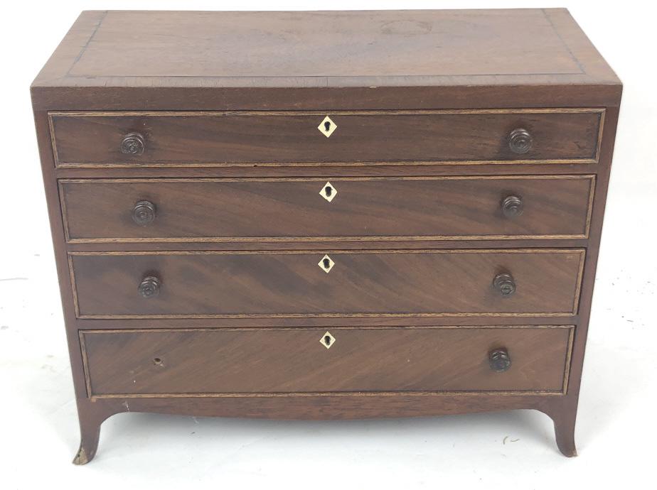 Georgian Style Diminutive Chest of Drawers 10 1/2" h x: Georgian Style Diminutive Chest of Drawers 10 1/2" h x 14" w x 6 1/2" d. Condition, missing one knob, some veneer loss to one leg, some scratches