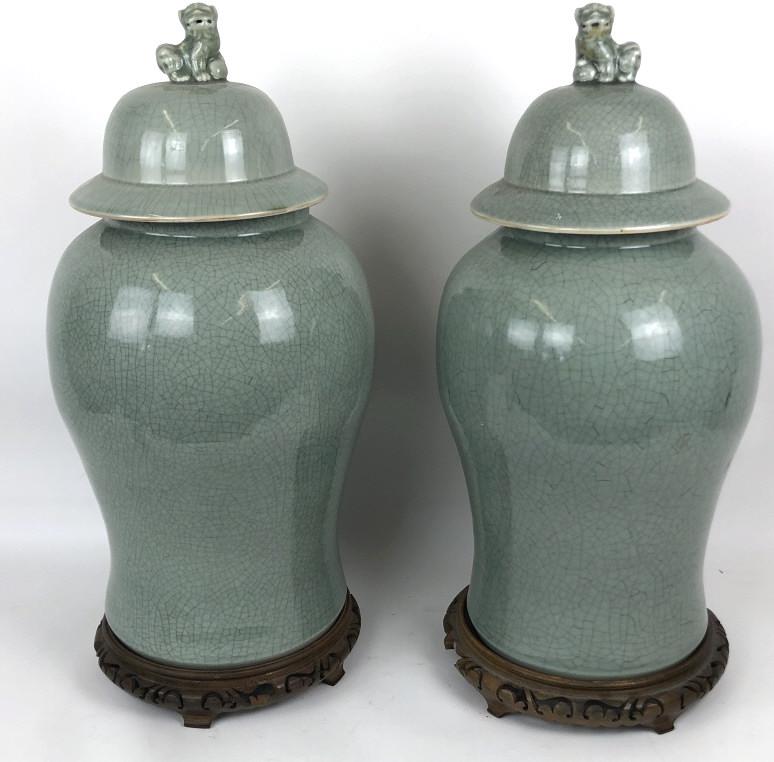 A Pair of Asian Celadon Lidded Vases On wooden stands. (1 of 6)