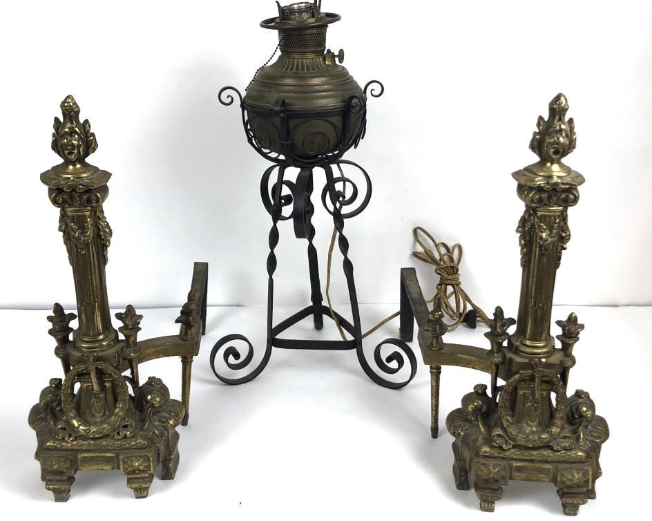 A Pair of Andirons & an Oil Lamp Oil Lamp is: A Pair of Andirons & an Oil Lamp Oil Lamp is electrified. Andirons are 19 3/4"h x 8 1/2" w x 18 1/4"d. Oil Lamp is 23"h. Condition, untested , needs cleaning