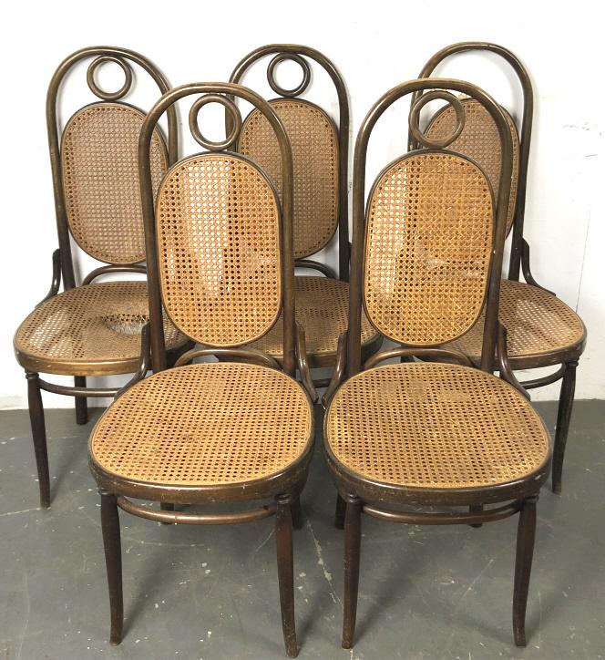 A Group of 5 Thonet Style Bentwood & Cane Chairs 43"h x: 43"h x 19"w x 18"d. Condition, cane broke on one seat, wooden ring missing on top of one seat
