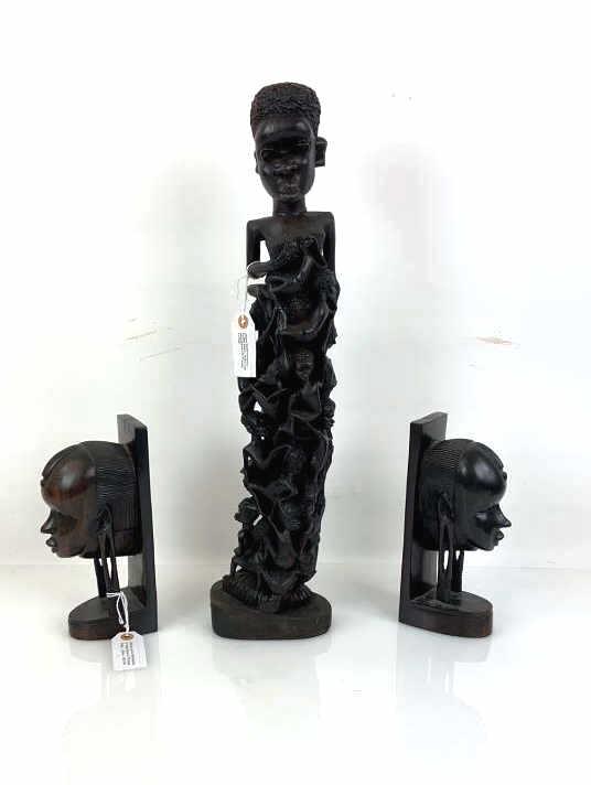 2 African bookends and a fertility carving Bust of: Bust of women bookends from Tanga East Africa. Fertility carving is 23 1/2" tall. Condition, light scratches and wear to wood.