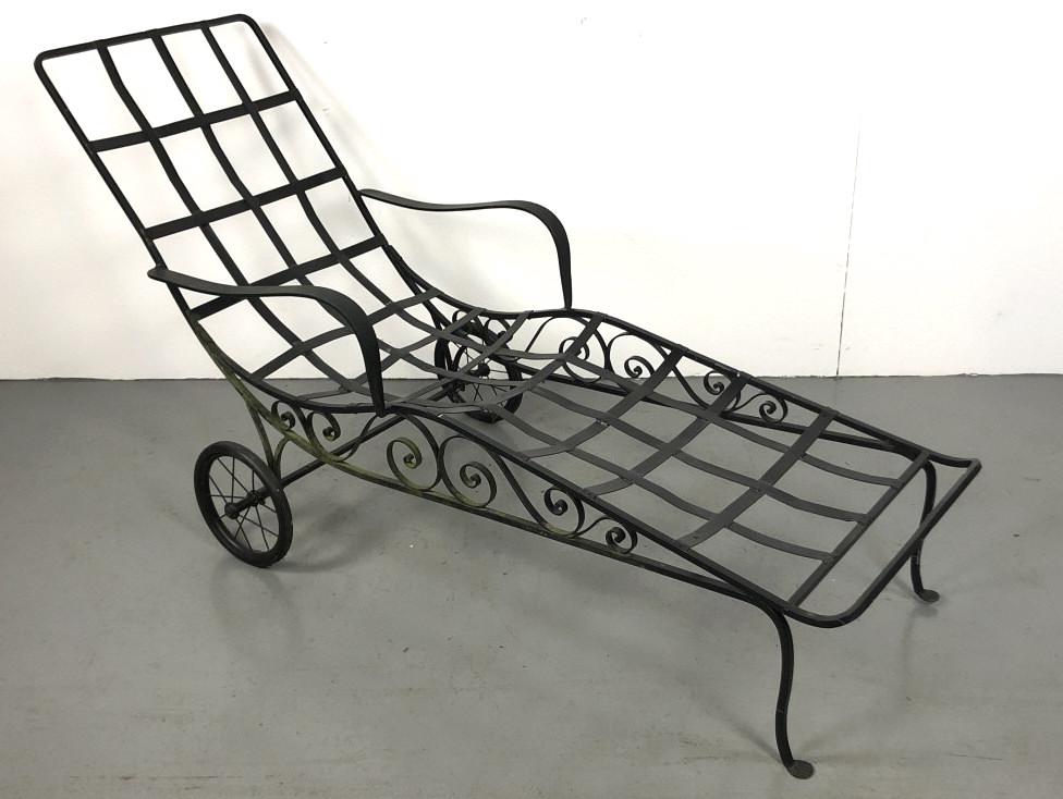 Wrought Iron Patio Chaise 36 1/2"h x 67"w x 29 1/4"d.: 36 1/2"h x 67"w x 29 1/4"d. Condition, wheels do not turn, no cushions, needs cleaning