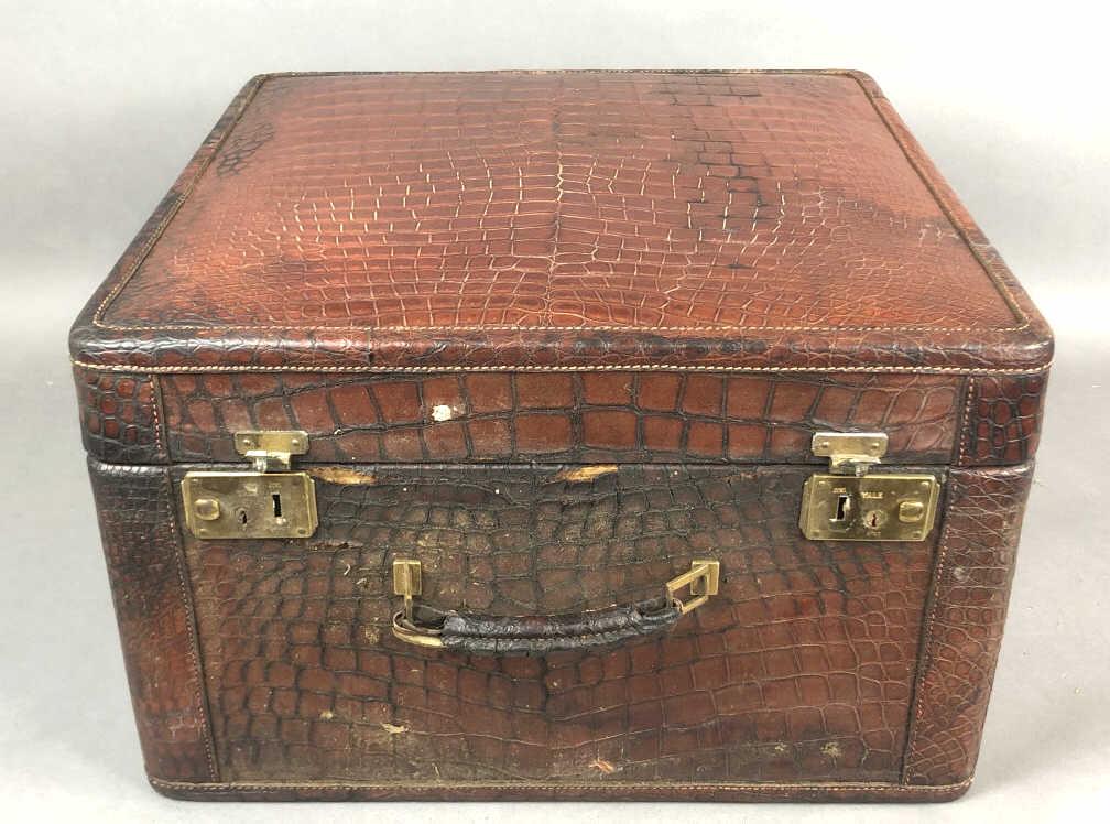 An Alligator Skin Traveling Case 12 1/2"h x 20 1/4"w x: 12 1/2"h x 20 1/4"w x 20"d Condition, some stains to interior, some loss of finish, and damage to front of suitcase