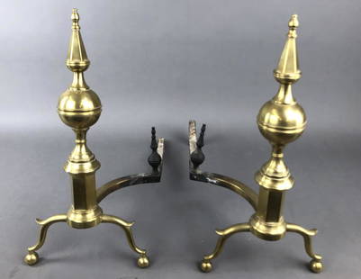 A Pair of Brass Andirons R. Whittingham NY: Signed. 20 1/2"h x 11 1/2"w x 23"d Condition, 1 cast iron rear leg missing, some heat tarnishing.