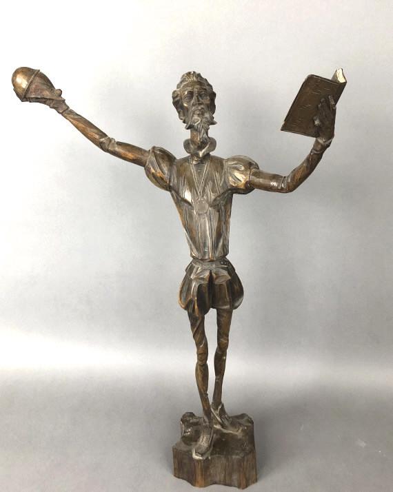 A Carved Figure of Don Quixote: 22 1/2"h x 15 1/2"w x 8"d. Condition, some minor chips