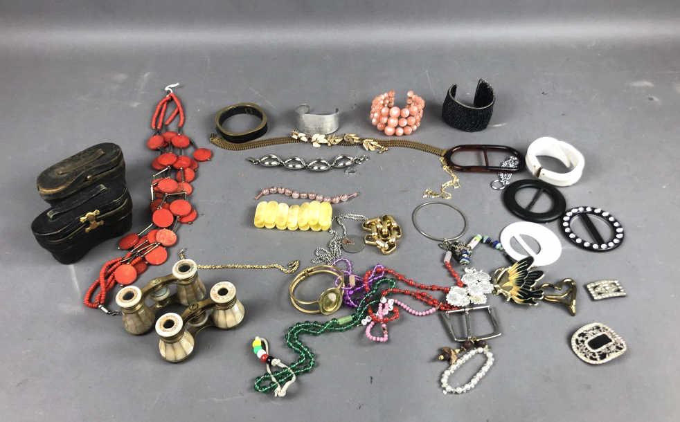 A Pair of Mother of Pearl Opera Glasses: Together with costume jewelry. Approx. 30 pieces Condition, overall wear and bottom missing from one opera glass case, some inside dirt to one lens.