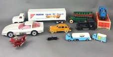 Group of Trains, Buses, & Cars: Comprising of a cast iron double decker bus, Nabisco big rig, 2 Corgi milk trucks, cast iron yellow cab, bugs bunny in a plane, James Bean Corvet, 2 Lionel trains, 1 miniature plastic train, Black Jac