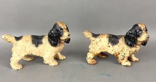 Pair of Cast Iron Dog Doorstops: 4.5"h x 6.5"w x 2.75"d Condition, some paint loss, some rust, some scratches and scuffs.