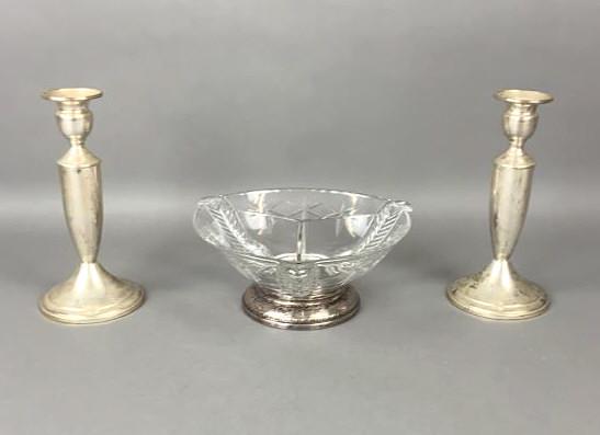 Group of 2 Poole Weighted Sterling Candle Holders: Together with weighted sterling glass bowl. Candle sticks 7.25"h Bowl 8"diam Condition, needs polishing, scratches on bowl.