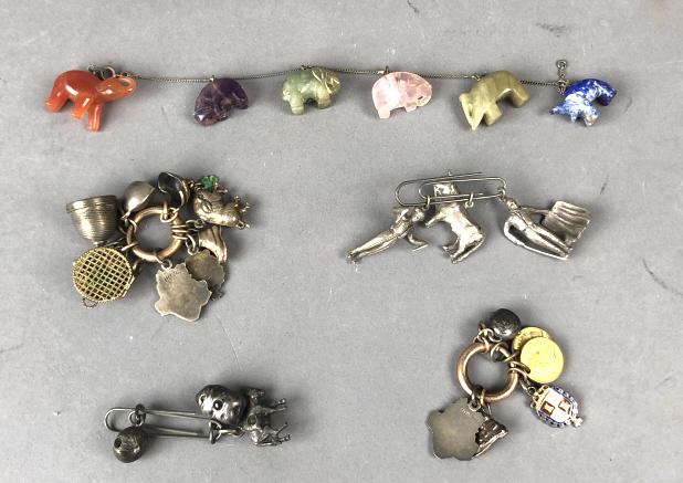 A Group of Charms: Including carved stone elephants, some sterling charms, etc. Approx. 5 bundles. Condition, needs cleaning, overall wear