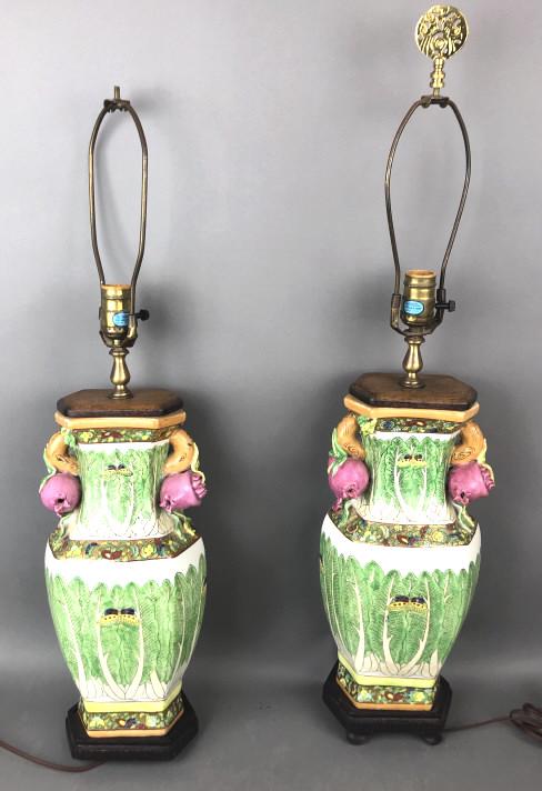 A Pair of Asian Style Floral Porcelain Lamps: Height to light socket is 22" Condition, missing feet off both wooden bases, untested, one finial missing from harp