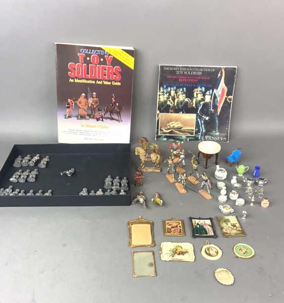 A Group of Eire & Authenticast Soldiers: Together with some Lineol soldiers and horses, "Collecting Toy Soldiers" book, a Guernsey's book, and dollhouse accessories. Average size of figures are 2 1/4" Condition, overall wear, some missing