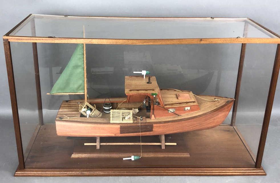 Model Fishing Boat in Case: 17"h x 28.75"w x 12"d Condition, good.
