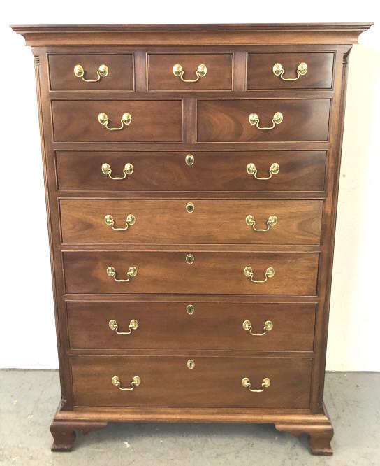 A Stickley Mahogany Tall Chest: Comprising of 5 short drawers and 5 long drawers. With concealed compartment in base. 60 1/2"h x 42 1/2"w x 21"d. Condition, some scuffs and scratches to base,