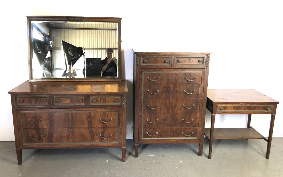 Walnut Partial Bedroom by Frederick Loeser & Co.: Comprising of tall chest, long chest ,side table, and mirror. Tall chest is 50 3/4"h x34"w x 20 1/4"d. Condition, scratches and scuffs, overall wear , some loss of metal molding, worn finish