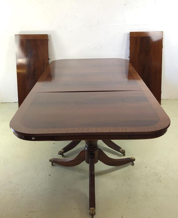 Georgian Style Mahogany 3 Pedestal Dining Table: With two 19 3/4" leaves Condition, some minor scratches and scuffs, some minor chipped veneer to edge