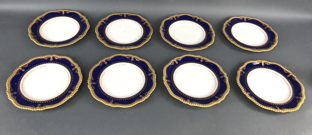 Set of 8 Copeland China Plates: With cobalt and gilt decoration . 10.25" Dia Condition, 1 plate is chipped. 1 plate is cracked