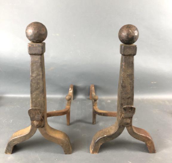 A Pair of Iron Andirons: 23 1/2"h x 12"w x 24 1/4" d. Condition, rust
