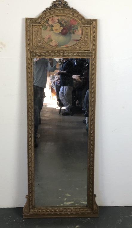 A Louis XVl Style Trumeau Mirror: 64 1/4"h x 23 1/2"w. Condition, wear to gilt and paint. some cracks, some loss of silvering to mirror