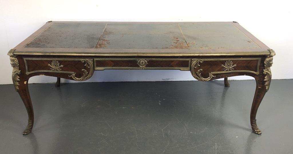 Louis XV Style Rosewood & Bronze Bureau Plat: Louis XV Style Rosewood & Bronze Bureau Plat.With leather and gilt tooled top.Manufactured by Jose Moliner Artal, Spain30"h x 79"w x 37"dCondition, chipped and cracked veneer, overall wear to leather 