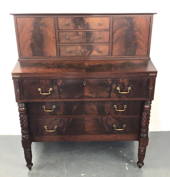 American 19C Mahogany Foldover Desk: American 19C. Mahogany Fold Over Desk. 47 1/2"h x 38"w x 19"d. Condition, some chipped veneer, some scratches and scuffs, some cracks.